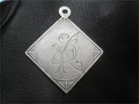 Жетон, кулон???